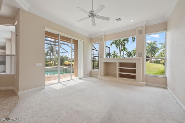 unfurnished living room with ceiling fan, light carpet, and crown molding