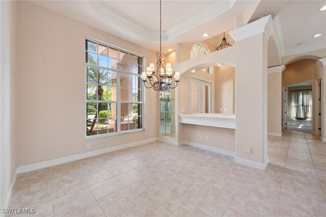 unfurnished dining area featuring a notable chandelier, light tile patterned floors, and ornamental molding