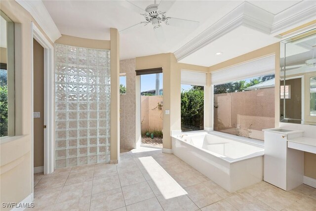 bathroom with tile patterned flooring, ceiling fan, and a washtub