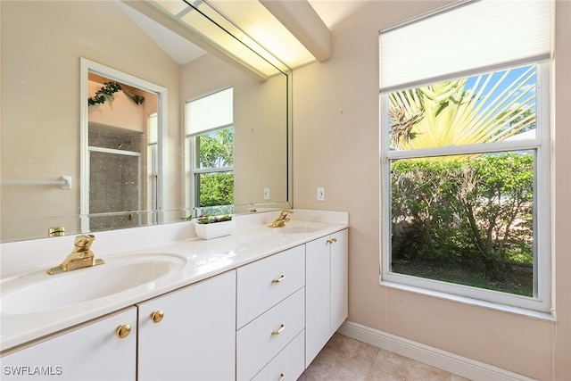 bathroom with lofted ceiling, tile patterned flooring, a shower with door, and vanity