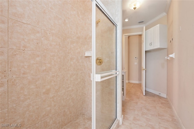 bathroom with walk in shower, ornamental molding, and tile patterned floors