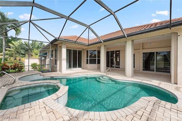 view of pool featuring glass enclosure and a patio area