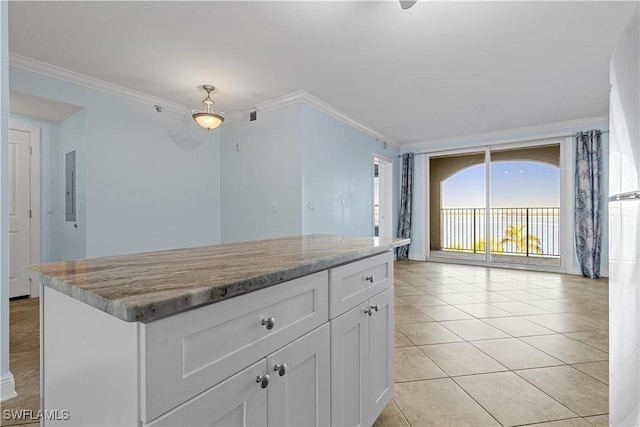 kitchen featuring electric panel, light stone countertops, ornamental molding, light tile patterned floors, and white cabinetry