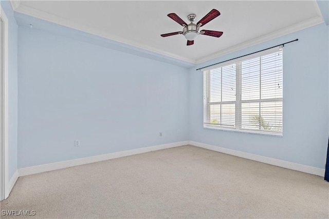 unfurnished room featuring crown molding, ceiling fan, and light carpet