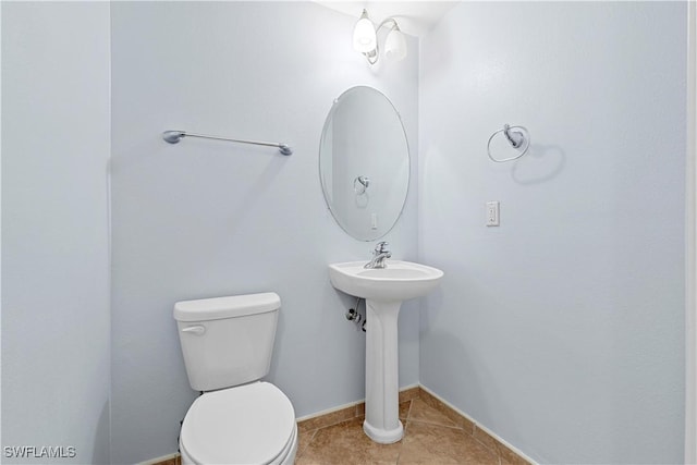 bathroom featuring tile patterned floors and toilet