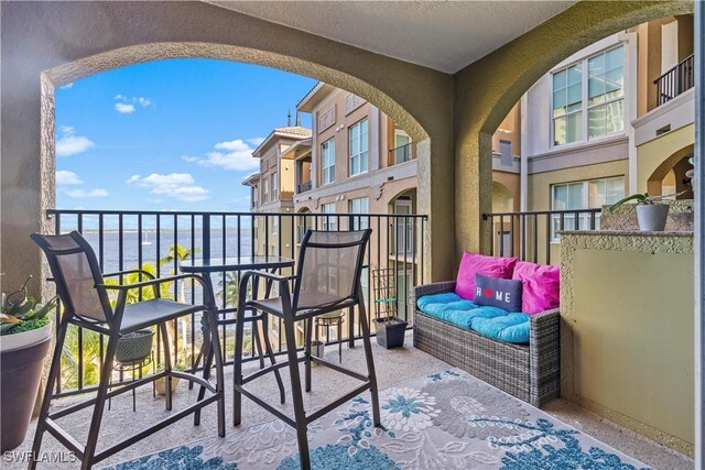 balcony featuring a water view