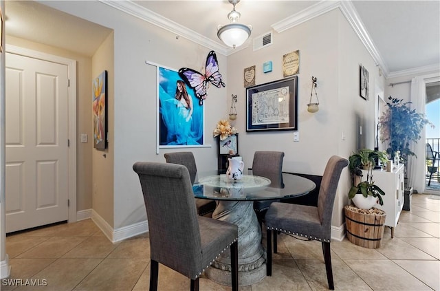 tiled dining room with ornamental molding