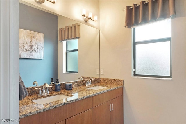 bathroom with a healthy amount of sunlight and vanity