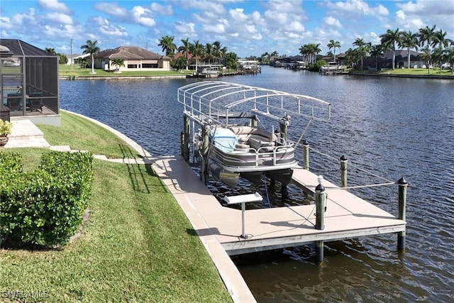 view of dock featuring a water view, a yard, and a lanai