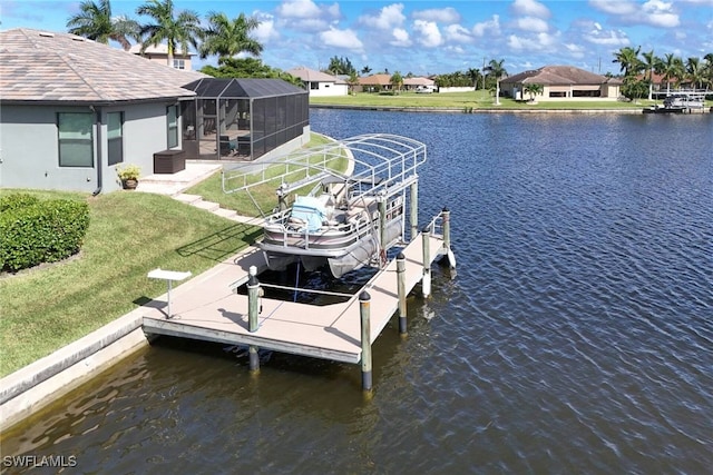 dock area featuring a water view, a yard, and a lanai