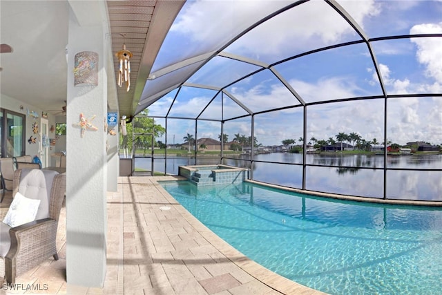 view of pool with a water view, glass enclosure, an in ground hot tub, and a patio area