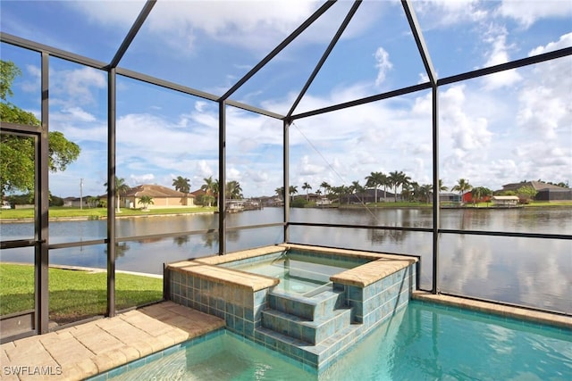 view of pool featuring a water view, glass enclosure, and an in ground hot tub