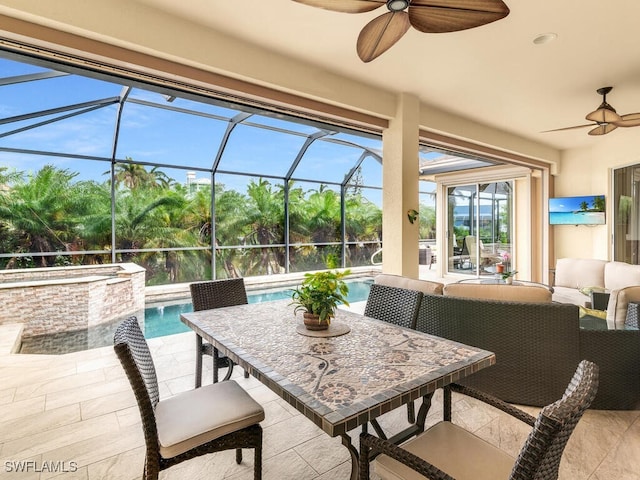 view of patio / terrace with an outdoor living space, a lanai, and ceiling fan