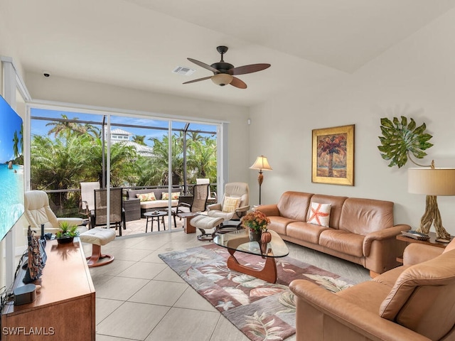 living room featuring light tile patterned floors and ceiling fan