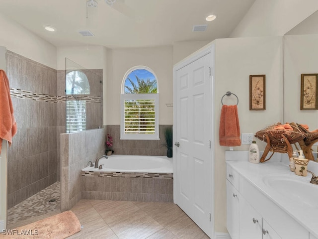 bathroom with vanity, independent shower and bath, and tile patterned flooring