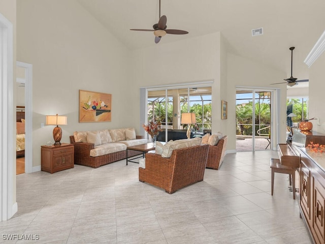 living room featuring ceiling fan, high vaulted ceiling, and light tile patterned floors