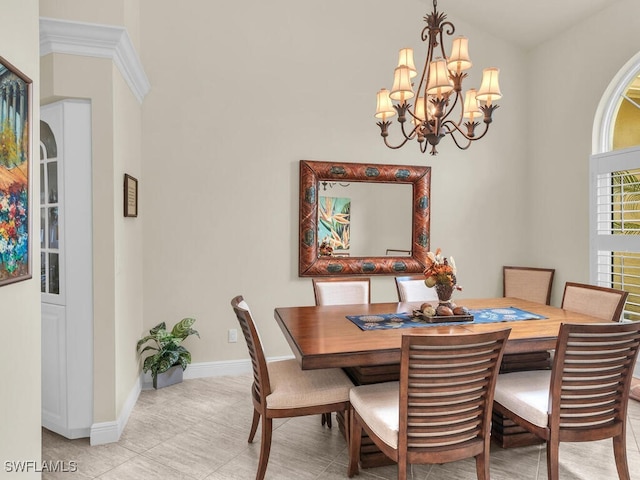 dining space with light tile patterned floors and an inviting chandelier