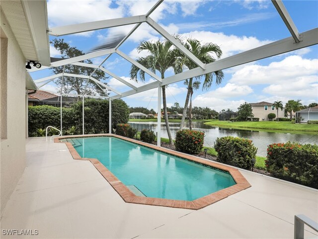 view of pool featuring a lanai, a patio, and a water view