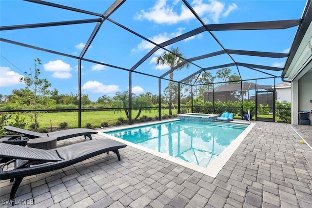 view of swimming pool featuring an in ground hot tub, glass enclosure, and a patio area