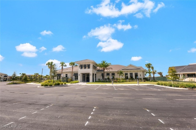 view of property with uncovered parking