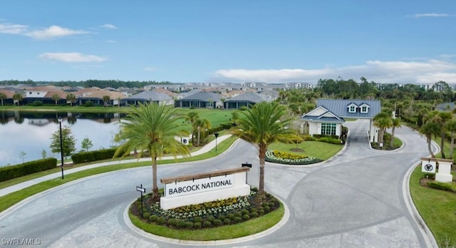 aerial perspective of suburban area with a large body of water