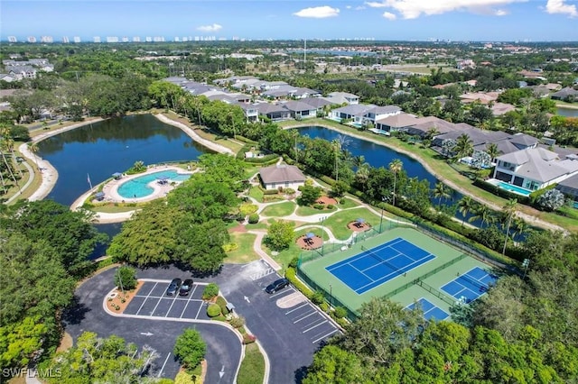 birds eye view of property with a water view