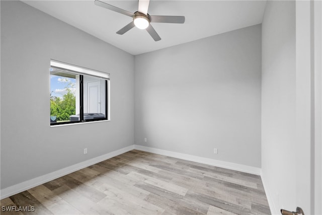 empty room featuring light wood-type flooring and ceiling fan