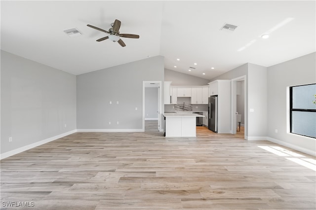 unfurnished living room featuring light wood-type flooring, ceiling fan, and high vaulted ceiling