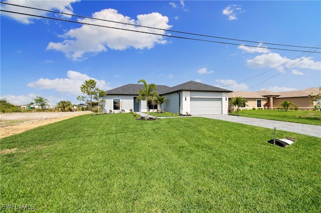 single story home with a garage and a front lawn