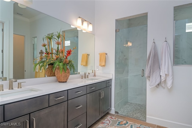 bathroom with vanity, tile patterned flooring, and a shower with door