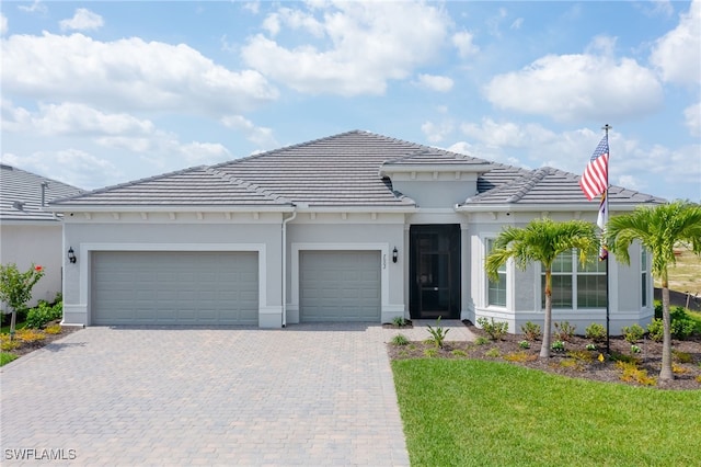 view of front facade with a garage and a front yard