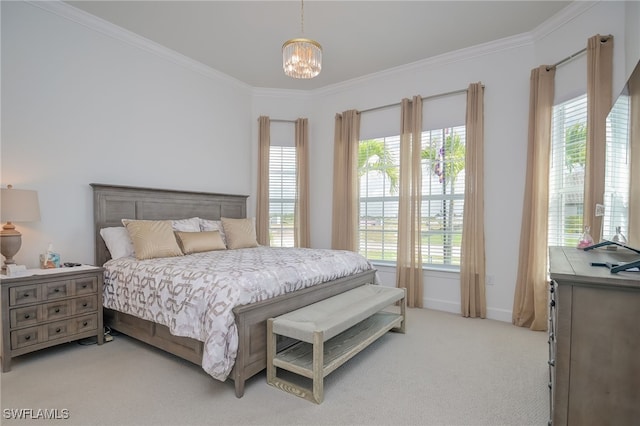 carpeted bedroom with ornamental molding, a chandelier, and multiple windows