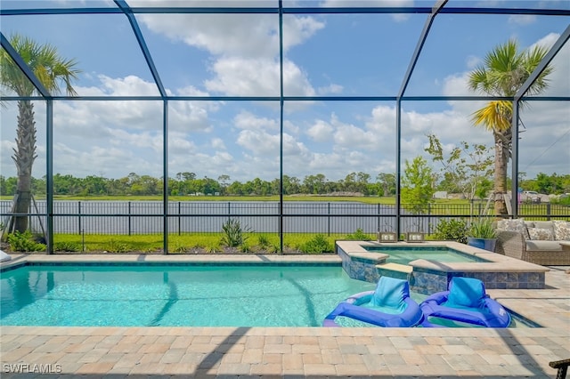 view of pool with glass enclosure and an in ground hot tub