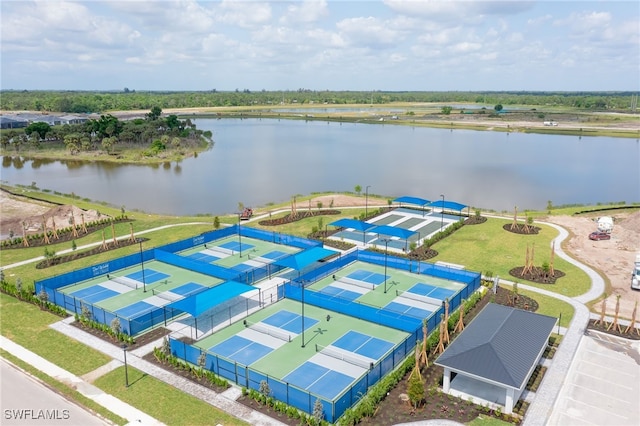 birds eye view of property with a water view