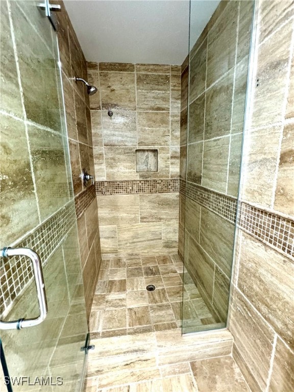 bathroom with an enclosed shower