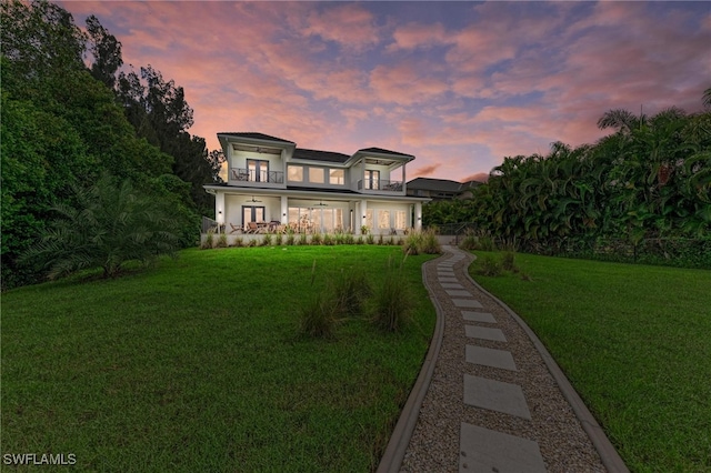 view of front of property with a lawn