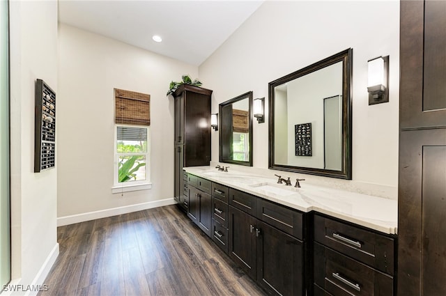 bathroom with vanity and hardwood / wood-style floors