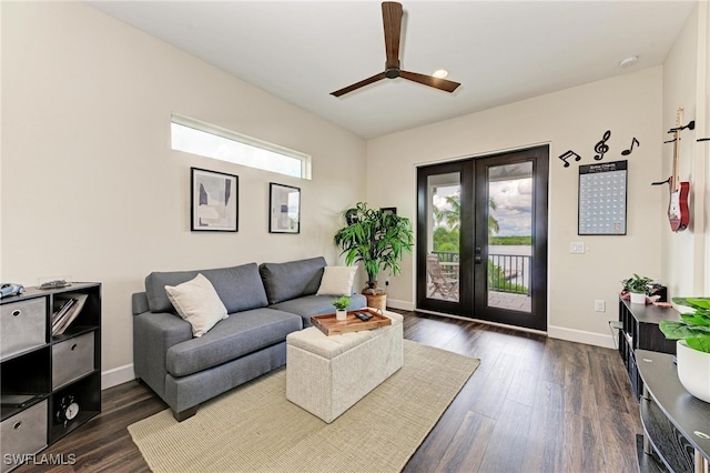 living room with a healthy amount of sunlight, dark hardwood / wood-style flooring, ceiling fan, and french doors