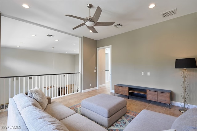 living room with ceiling fan and light tile patterned flooring