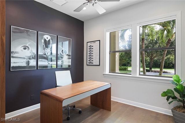 home office with dark hardwood / wood-style flooring, ceiling fan, and plenty of natural light