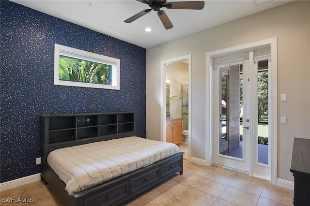 bedroom with access to outside, connected bathroom, ceiling fan, and multiple windows