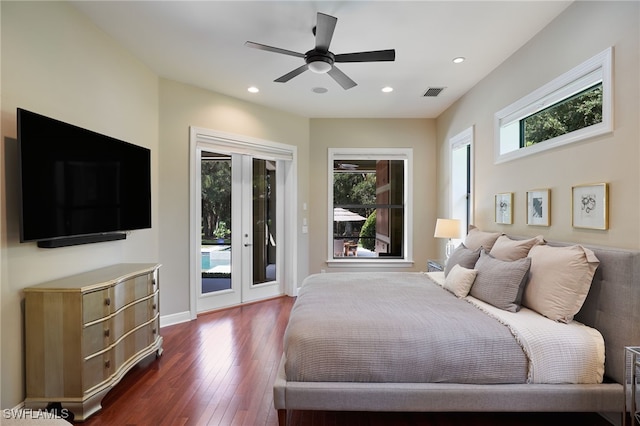 bedroom featuring access to outside, ceiling fan, multiple windows, and dark hardwood / wood-style floors