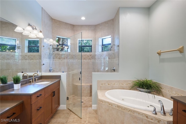 bathroom featuring separate shower and tub, tile patterned flooring, and vanity