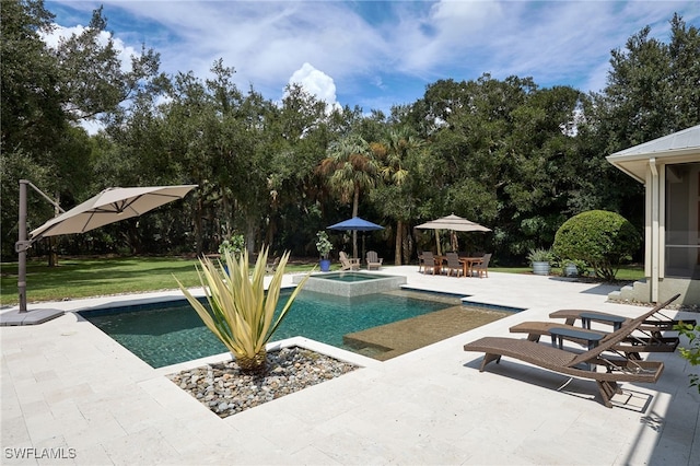 view of swimming pool with a lawn, a patio area, and an in ground hot tub