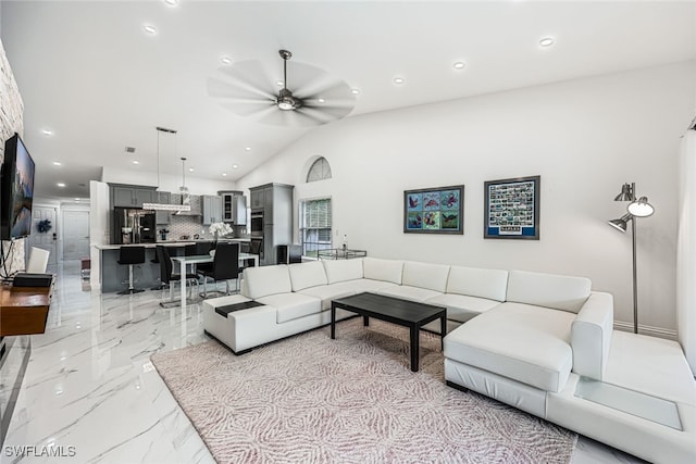 living room with vaulted ceiling and ceiling fan