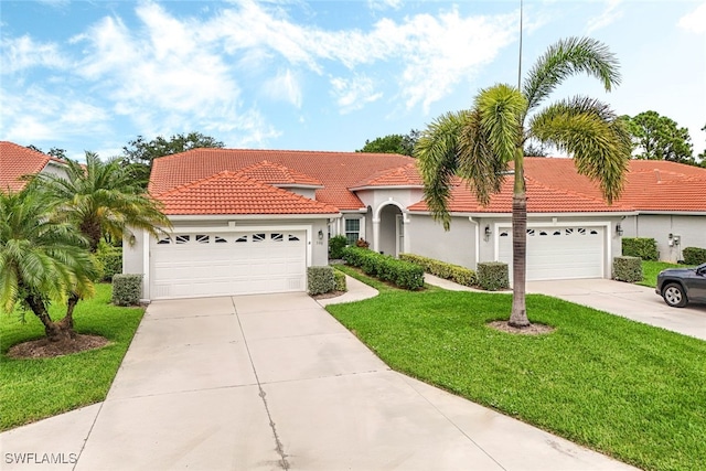 view of front of house featuring a garage and a front lawn