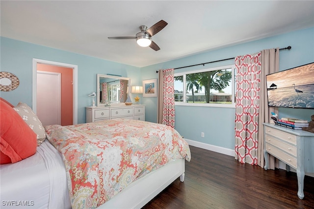 bedroom with dark hardwood / wood-style flooring and ceiling fan