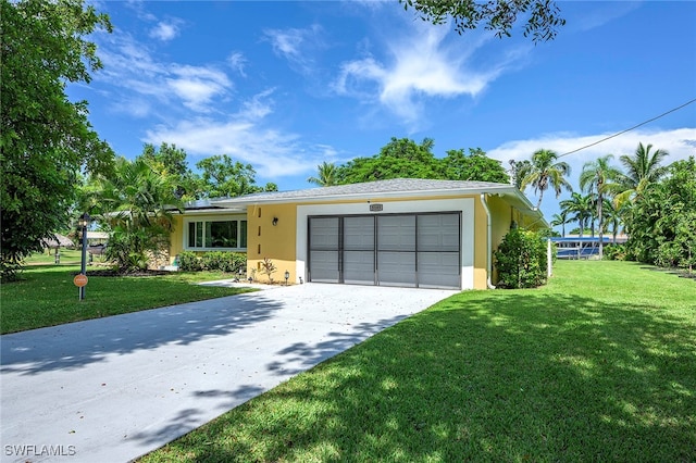 ranch-style house with a garage and a front yard