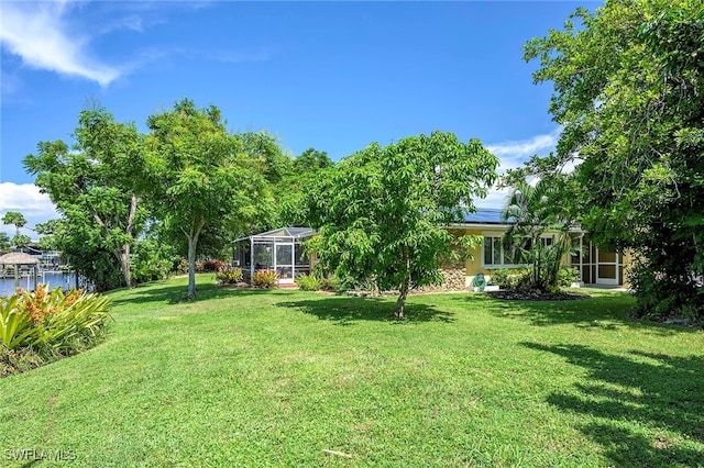 view of yard with a lanai