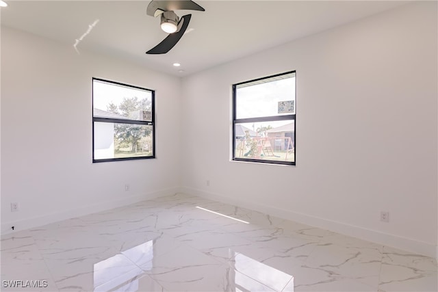 spare room featuring ceiling fan